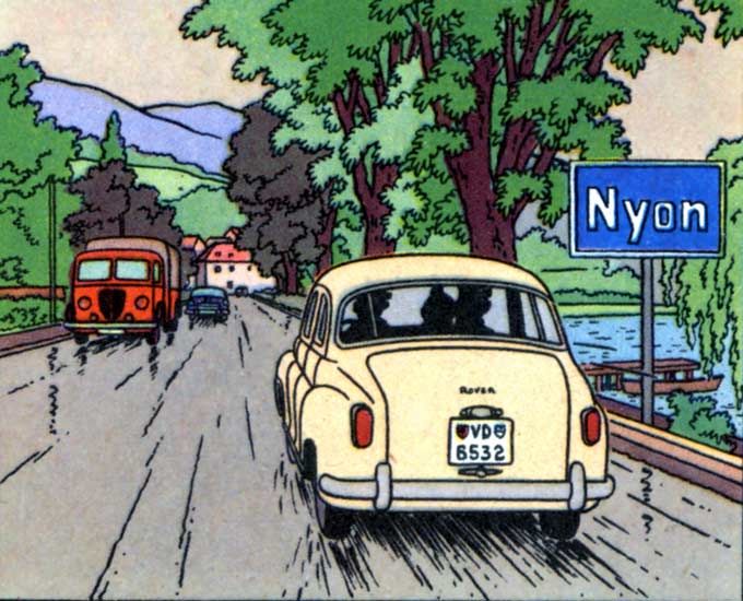 Rover P4 jaune qui roule en direction de la ville de Nyon précisée sur la pancarte.